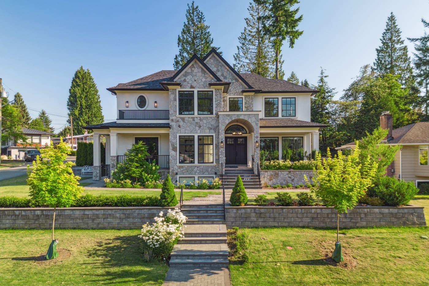 Front elevation of a two-storey home with natural stone facing