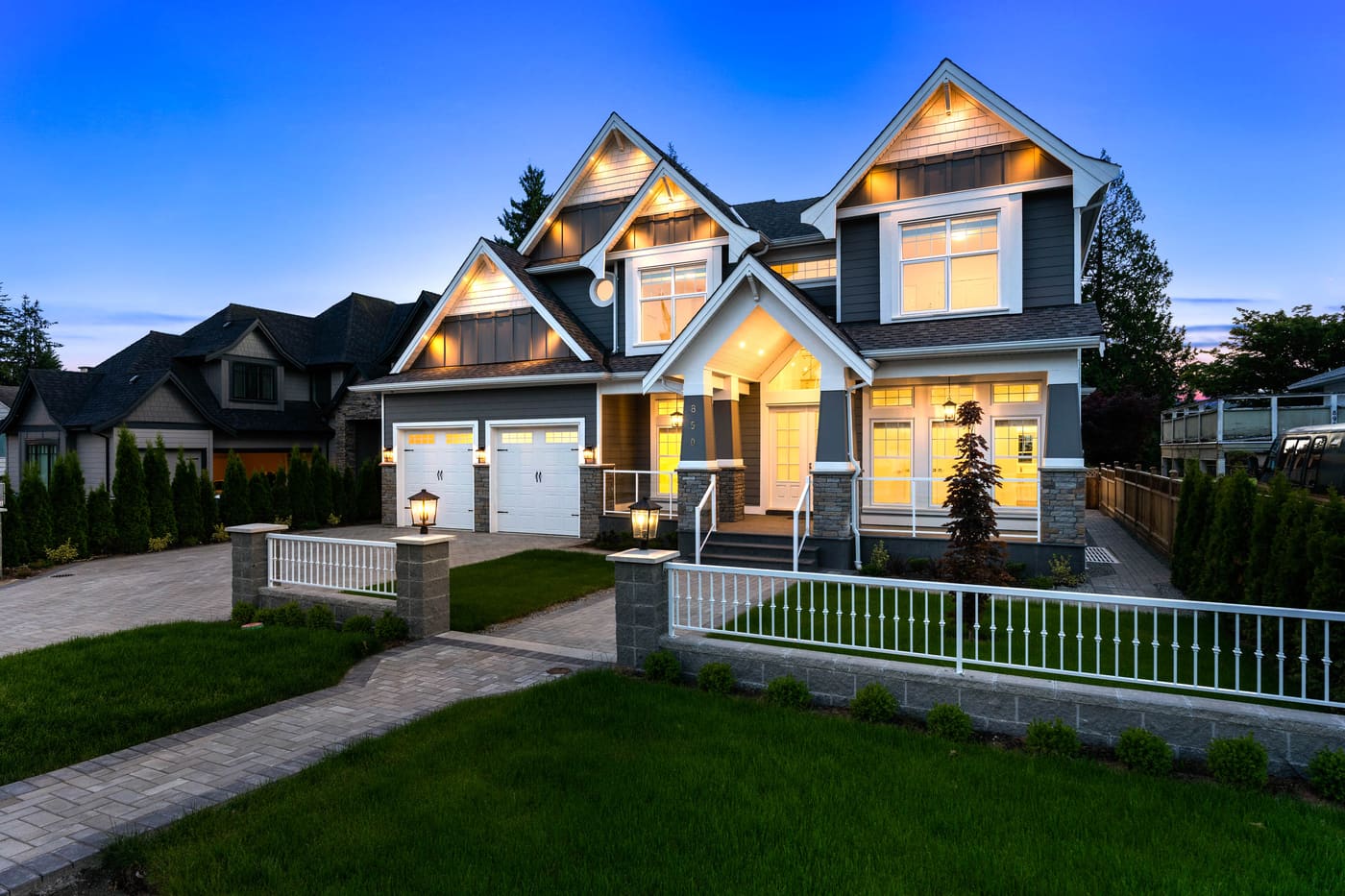 Craftsman-style home at dusk, angled view