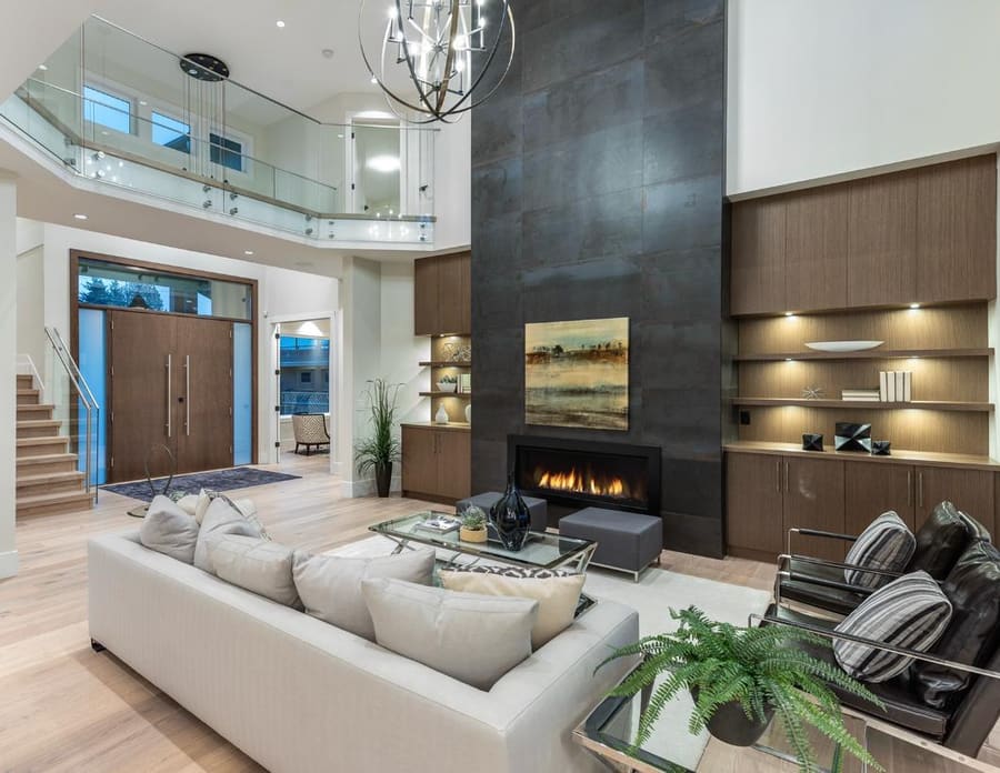 Double-height living room with a floor-to-ceiling fireplace